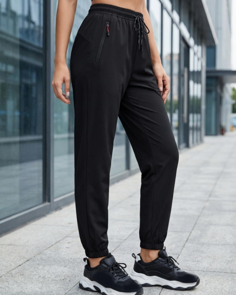 Rebecca Pantalón Deportivo Mujer – Tejido Secado Rápido, Cintura Alta y Bolsillos Zip
